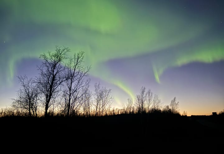 Aurora sky used as Nordic season-choice context