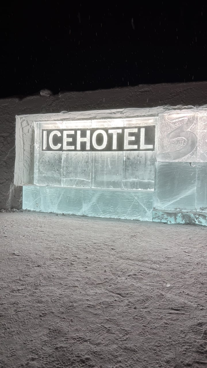 Illuminated ice building glowing on a dark winter night