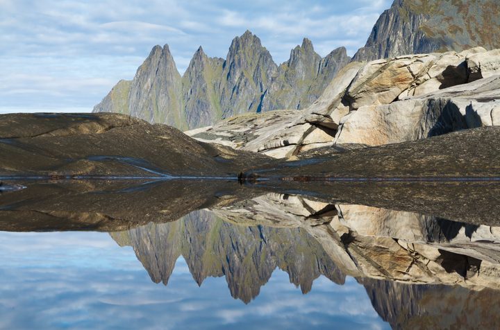 Okshornan peaks reflected in a rock pool at Tungeneset on Senja in September