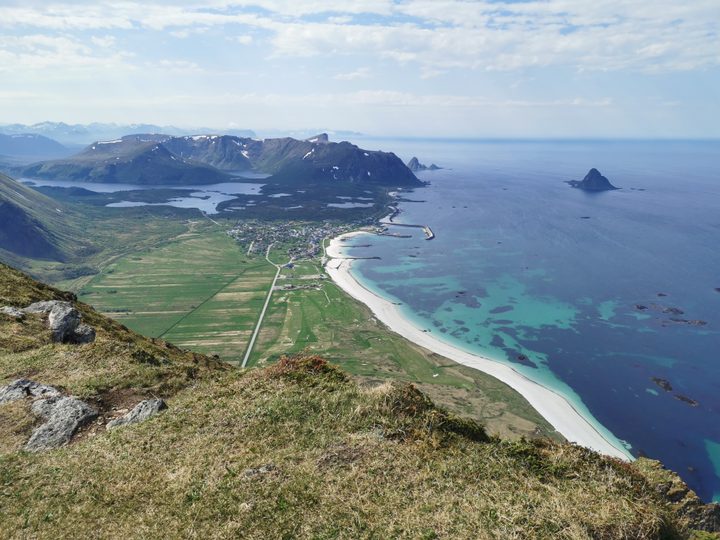 Bleik village, its white beach, Storvatnet lake and Bleiksøya island viewed from Røyken on Andøya in May